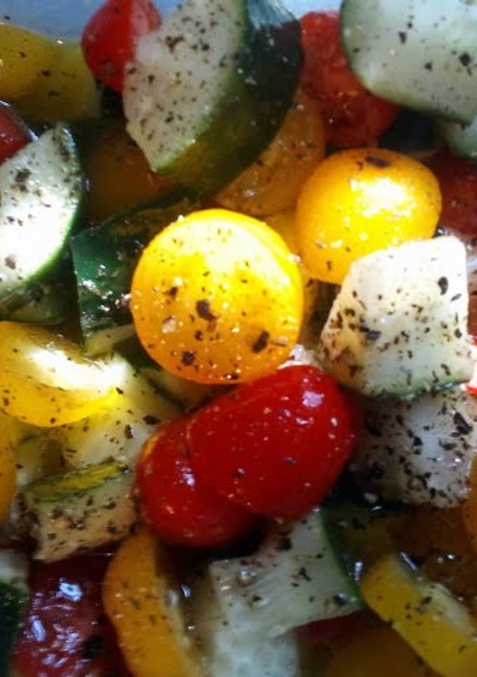 A picture of Cherry tomato and cucumber salad.