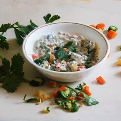 A picture of A healthy breakfast-Fermented Farro with curd, sprouts, and veggies.