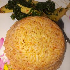 A picture of Jallof rice with spinach.
