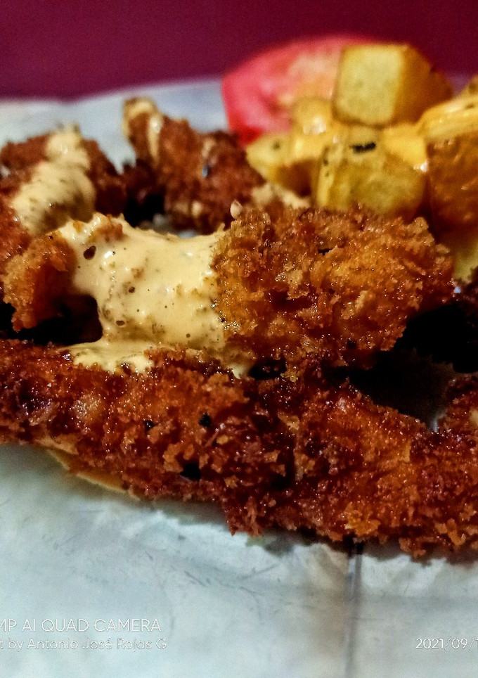 Una foto de Pollo y lomo con panko