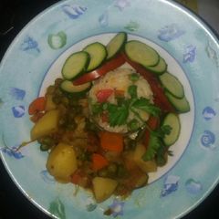 A picture of Riced salad served with peas stew.