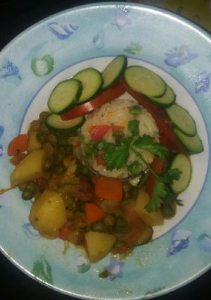 A picture of Riced salad served with peas stew.