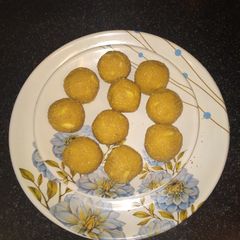 Suji or besan ladoo with desiccated coconut and dry fruits A picture of Suji or besan ladoo with desiccated coconut and dry fruits.