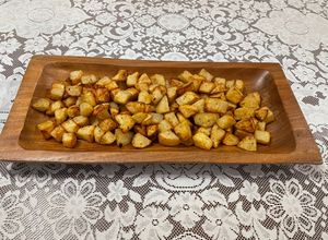Una foto de Papas doradas al limón y especias en air fryer