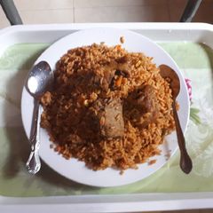 A picture of Bill of rice, vegetables and fried chicken.
