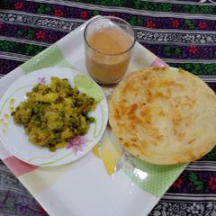 A picture of ANDEY MATAR AALOO KA BHURTA RESHMI PARATHA & TEA.
