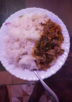 A picture of Boiled rice with beef stew.