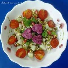 A picture of Salad with beet n cheese hearts.
