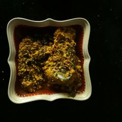 A picture of Egusi soup with fresh fish.