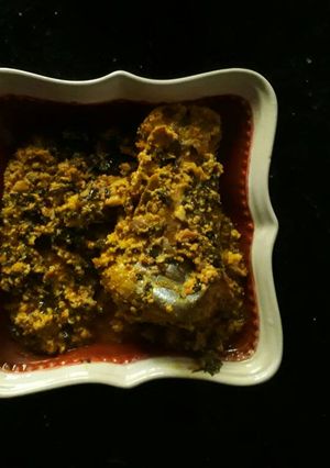 A picture of Egusi soup with fresh fish.