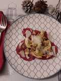 Carpaccio di carciofi bresaola petali di parmigiano noci