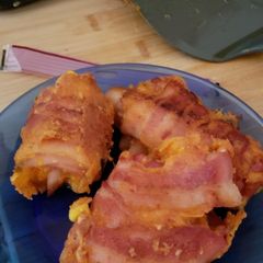 A picture of Egg and cheese bacon roll ups.