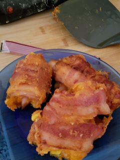 A picture of Egg and cheese bacon roll ups.