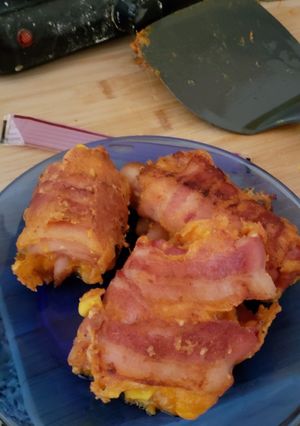 A picture of Egg and cheese bacon roll ups.