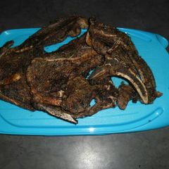 A picture of T bone with spicy herbs.