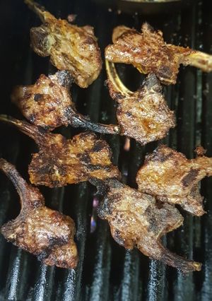 A picture of Lamb chops takeaway style.
