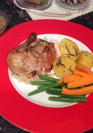 A picture of Roast Chicken with deep fried potatoes.