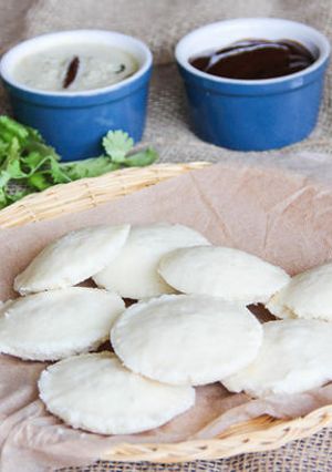 A picture of Idli-South Indian soft pillowy steamed lentil rice cakes.