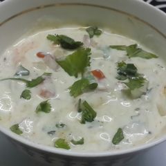 A picture of Onion Tomato & Cucumber Raita.