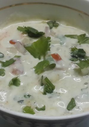 A picture of Onion Tomato & Cucumber Raita.