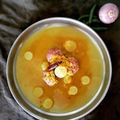 Ragi Mudde with brown rice and moolangi sambar A picture of Ragi Mudde with brown rice and moolangi sambar.