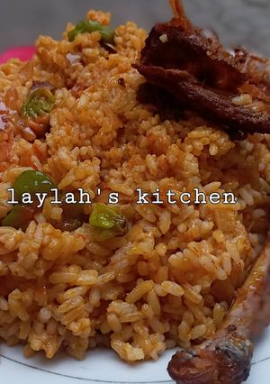 A picture of Left over rice into native Jollof rice 🤣🤣.