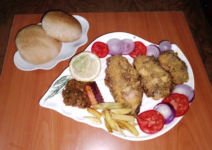 Baked fish 🐠🧄🧅🍋🍅 Recipe by Gurpal kaur Ubhi - Cookpad