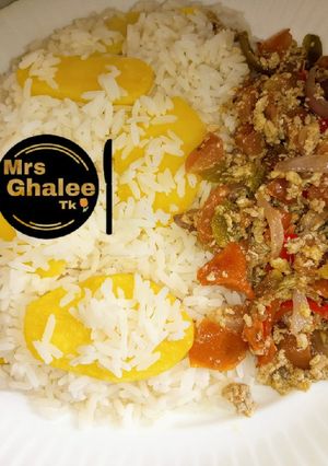 A picture of White rice with egg sauce.