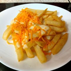 A picture of My Cheesy Sauce over Chips. 😘.