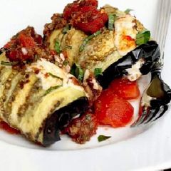 A picture of Rolled up brinjal with stuffings.