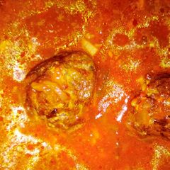 A picture of Meatballs in tomato sauce.