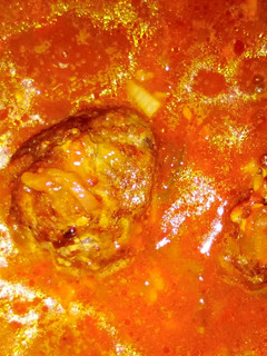 A picture of Meatballs in tomato sauce.