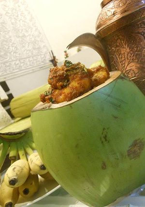 A picture of Masala Prawns stuffed in Fresh Tender Coconut.