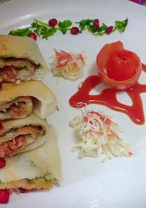 A picture of Carrot cheese pomegranate roll dosa.