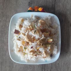 A picture of Narali bhat (Coconut rice).