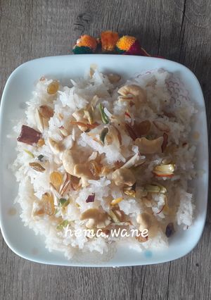 A picture of Narali bhat (Coconut rice).