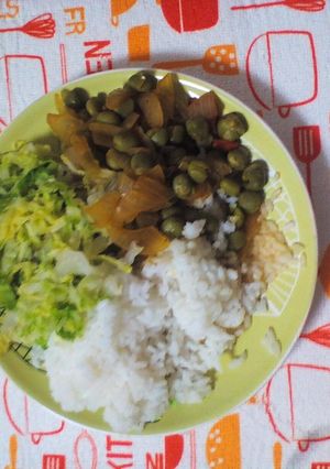 A picture of Rice and green peas.