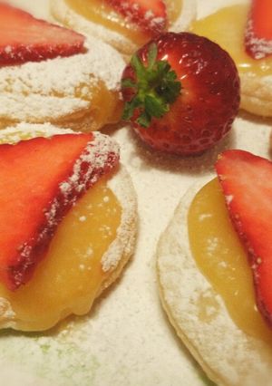 A picture of Lemon curd and strawberry puffs.