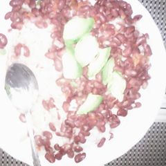 A picture of Mchele (Rice) and fried beans.