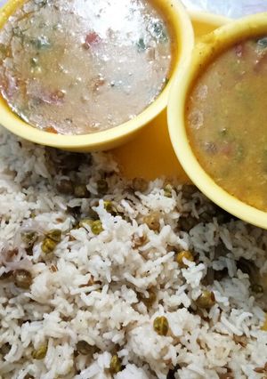 A picture of Dhaba style dal tadka and green chane rice.