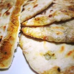 A picture of Aloo Paratha / Spicy Potato Stuffed Indian Flatbread.