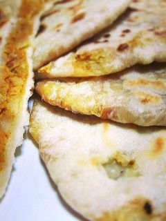 A picture of Aloo Paratha / Spicy Potato Stuffed Indian Flatbread.