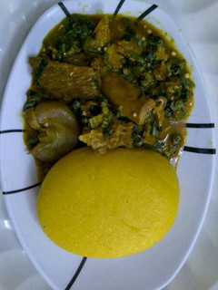 A picture of Okra soup and eba.