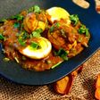 Boiled egg curry with peas