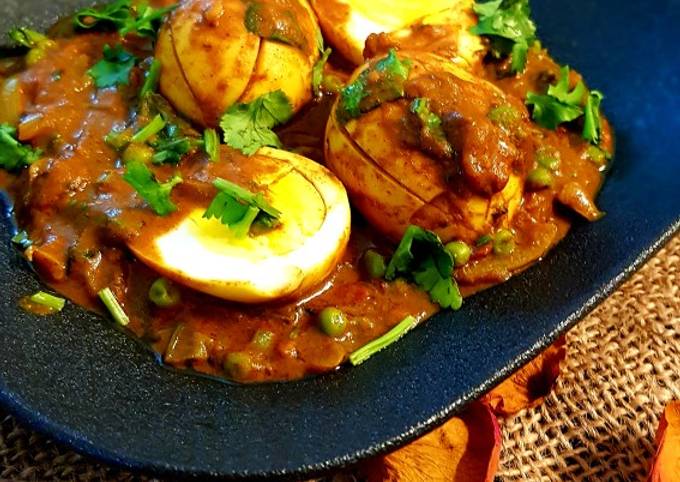 Boiled egg curry with peas