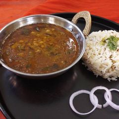 A picture of Tuvar aalu ki sabji with jeera rice.