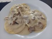 Una foto de champiñones en lata