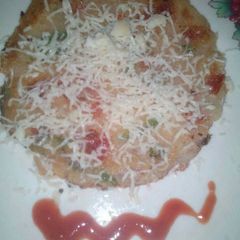 Cheesy semolina uttapam with italian touch A picture of Cheesy semolina uttapam with italian touch.
