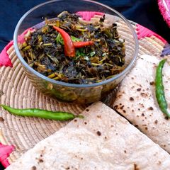 A picture of Three spice kulfa saag.