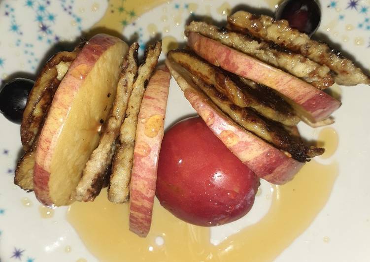 Banana pancake with apple and grapes sticks